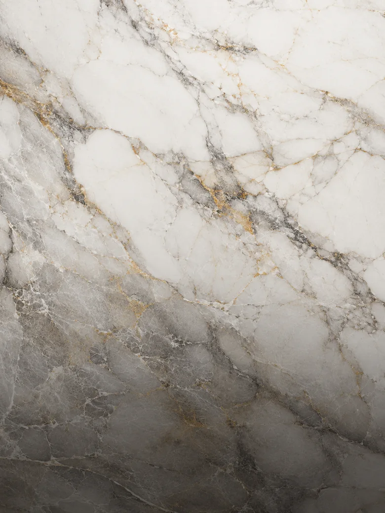 White marble surface with grey and warm gold natural veining